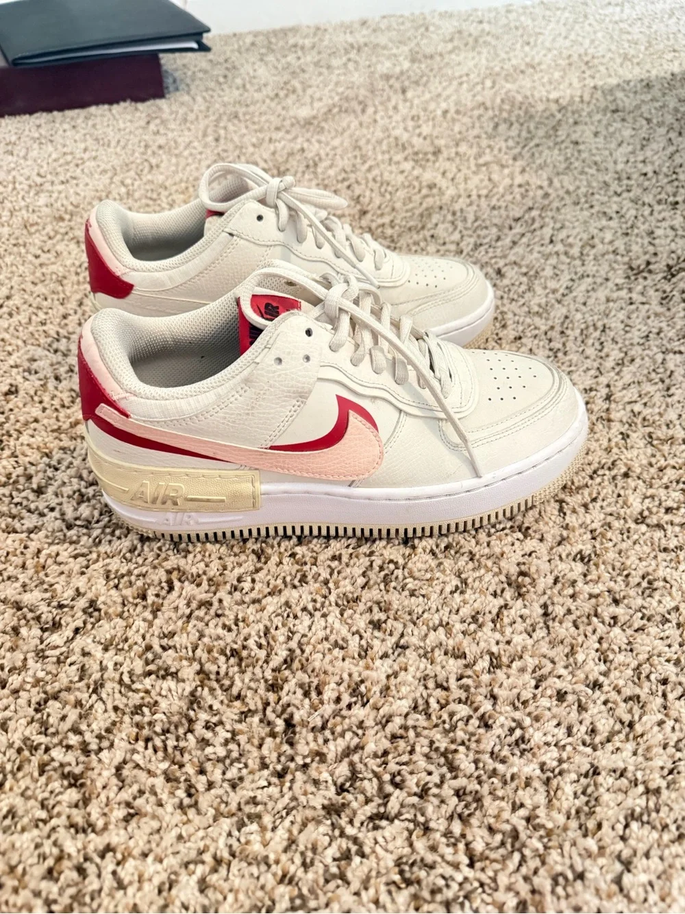 Nike Low-Top Sneakers in Cream with Pink and Red Accents